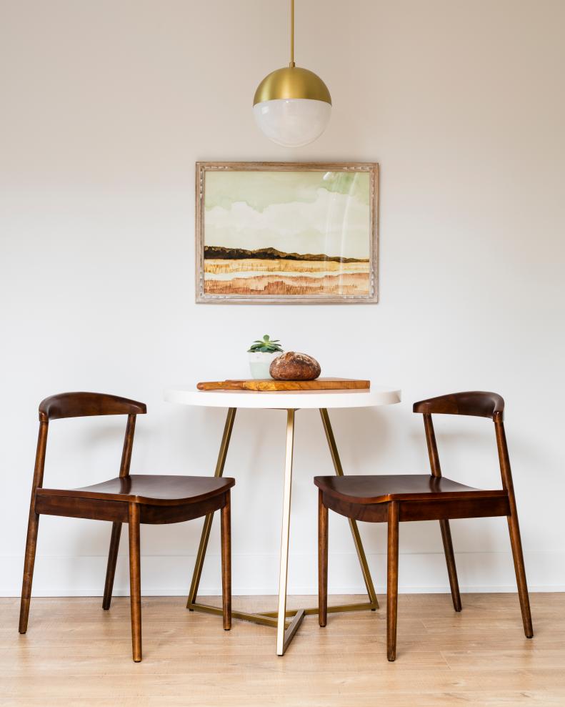 Midcentury modern table and chairs with pendant light.