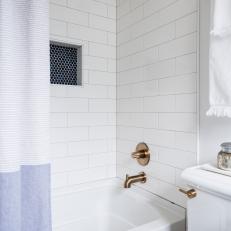 White Bathroom with Subway Tile and Modern Fixtures