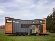 Modern Tiny House With Blue Metal And Natural Wood Siding And Custom Windows