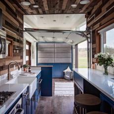 Tiny House Galley Kitchen And Living Room With Rustic Accents