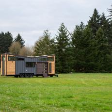 Modern Tiny House With Blue Metal And Wood Siding