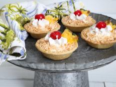 This easy recipe will transport party guests to a tropical state of mind, no matter the season or occasion. These handheld mini tarts are a perfect sweet treat for weddings, summer soirees, bridal or baby showers or fall tailgates. Use ready-made pastry shells to shortcut the prep time.