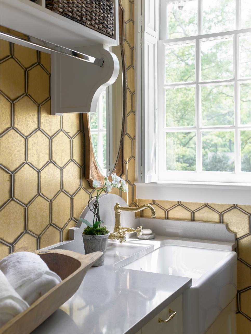 Contemporary Gold and Black Laundry Room with Wallpaper | HGTV