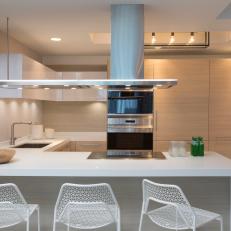 Modern Kitchen With White Mesh Barstools