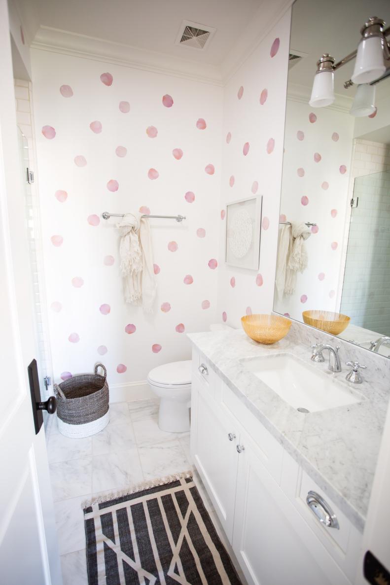 transitional kids' bathroom with pink polka dots