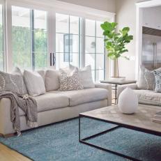 Neutral Living Room Sofa Layered With Patterned Pillows