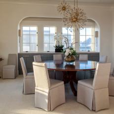 Neutral Dining Room With Arched Opening
