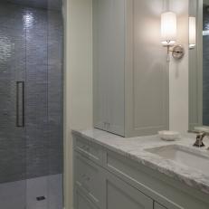 Gray and White Bathroom With Marble Countertop