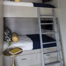 Gray Paneled Bunk Beds and Gold Table