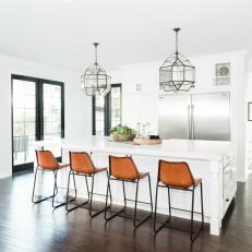 Black and White Kitchen With Brown Barstools
