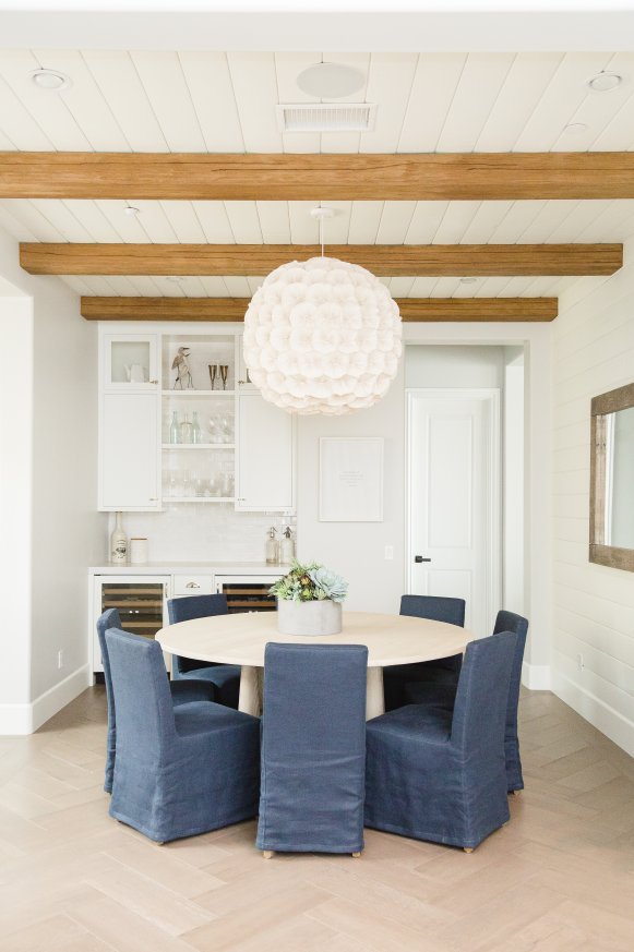 transitional white dining room with bar