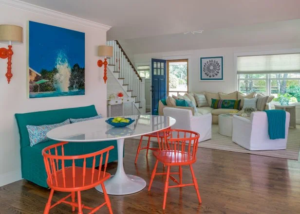 contemporary dining room with red chairs