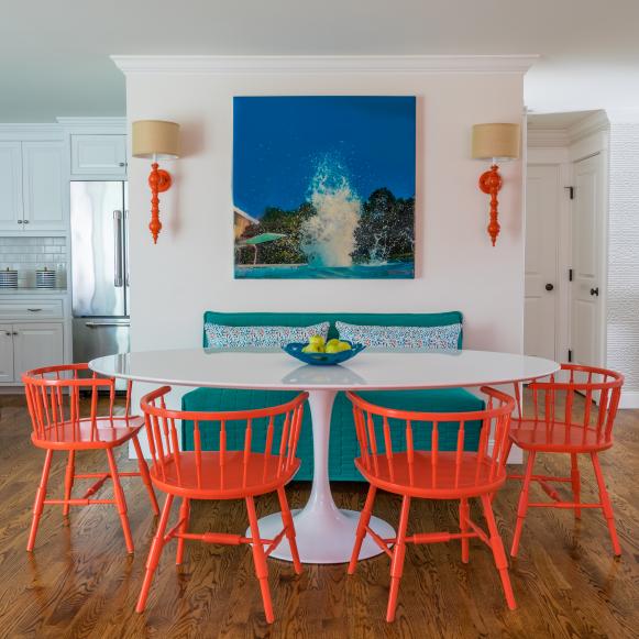 contemporary dining area with red chairs