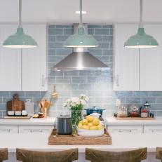 Contemporary White Kitchen with Light Blue Tile Backsplash 