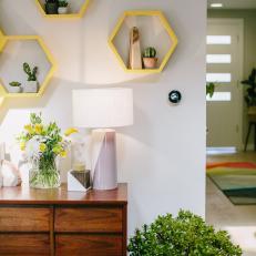 Contemporary White Living Room with Yellow Hexagon Shelves 