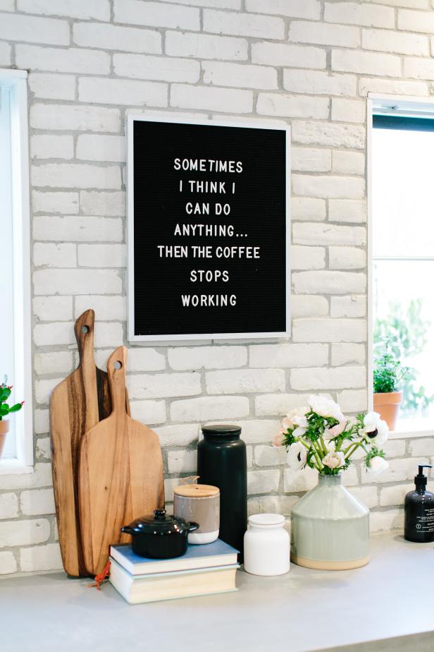Modern White Kitchen with a Black Message Board HGTV