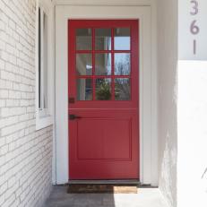 Contemporary White Front Porch with Red Door 