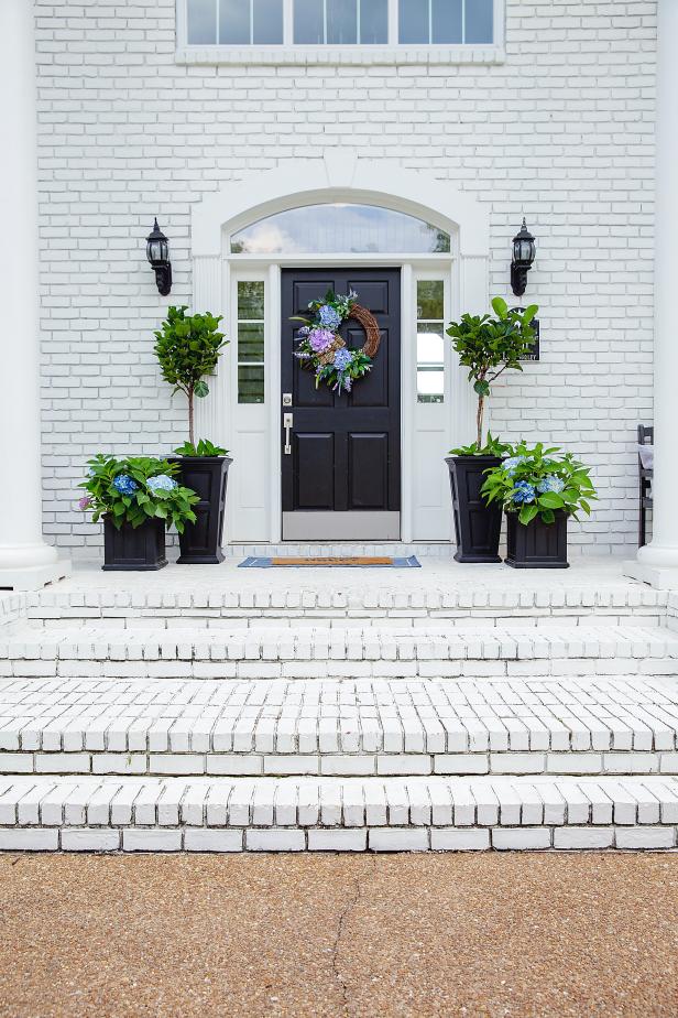 Jenny Reimold shares how she uses a mix of faux and real flowers in her front porch planters to achieve full, colorful containers year-round.