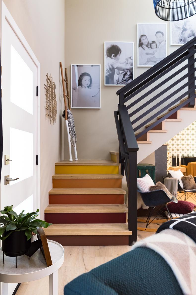 Neutral Staircase with Black Rail, Yellow and Orange Risers 