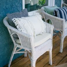Contemporary Blue Porch with White Wicker Chairs 