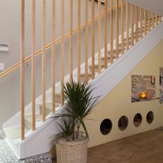 Contemporary Yellow Stairs with Neutral Wood Railing 