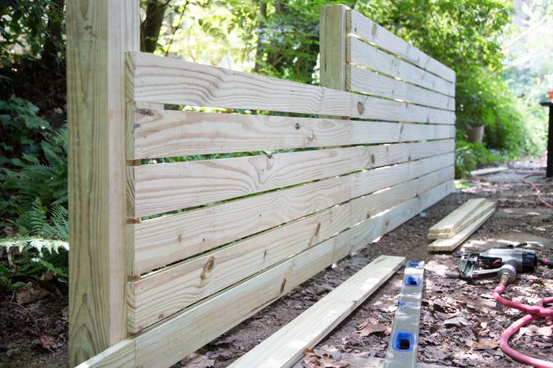 While planning your dog run, choose an area that’s accessible from the house and will be easy to fence. Keeping it close to a back or side door will ensure easy access for you and your fur baby will enjoy it more frequently. When scoping out a location also avoid steep rocky slopes or areas with lots of surface roots, which can be a major headache when it’s time to dig deep holes for fence posts.