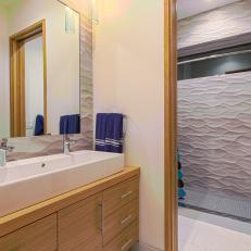 Small Bathroom Boasts Basin Sink, Textured Walls