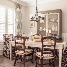 Traditional Dining Room With Cowhide Chairs