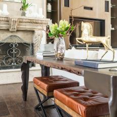Eclectic Living Room With Wood Console Table, Brown Leather Ottomans