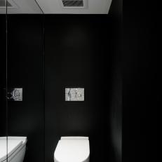 Black and White Powder Room With Mirror Wall