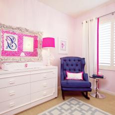 Girl's Nursery Equipped With Contemporary Changing Station