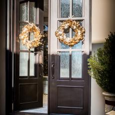 Traditional Front Doors With Gold Metallic Christmas Wreaths