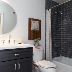 Contemporary Black and White Bathroom with Black Subway Tile Backsplash