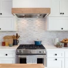 Contemporary White Kitchen with Gray Tile Backsplash and White Cabinets