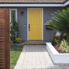 Contemporary Gray Home Exterior with Yellow Door 