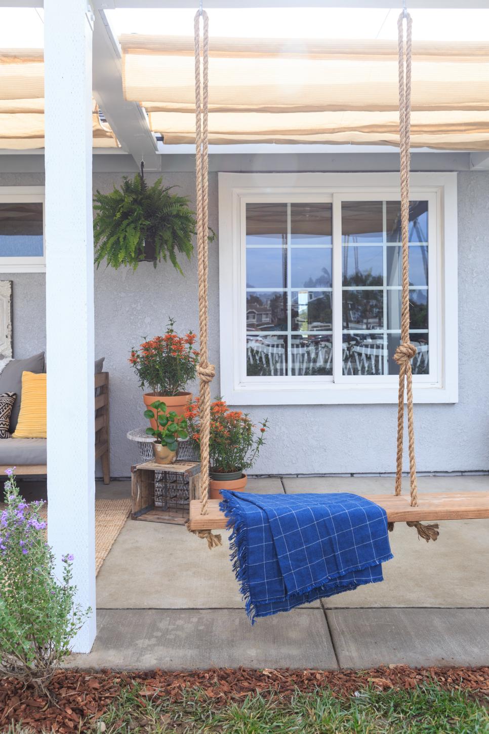 Contemporary Neutral Front Porch with Brown Wooden Swing ...