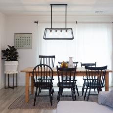 Contemporary Neutral Dining Room with Neutral Table and Black Chairs 