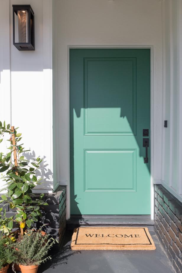 Contemporary White Home Exterior with Green Door | HGTV