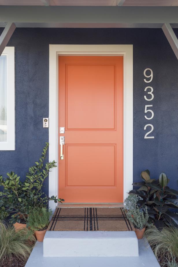 Eclectic Blue Home Exterior with Orange Front Door | HGTV