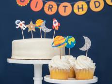 White Cake and Cupcakes With Planet Toppers