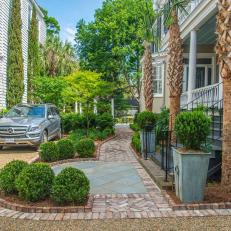 Traditional Driveway Landscape With Brick And Gravel Paths