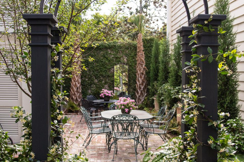 Courtyard With Table And Chairs And Greenery