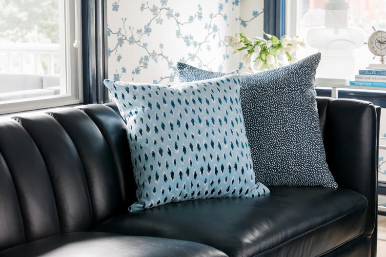 Black Leather Sofa and Blue Pillows