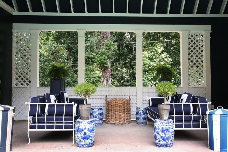 Chinoiserie garden stools, daybeds, a basket for pool toys and towels and witty painted trash cans make this pool house a comfortable and stylish space for both parties and family time.