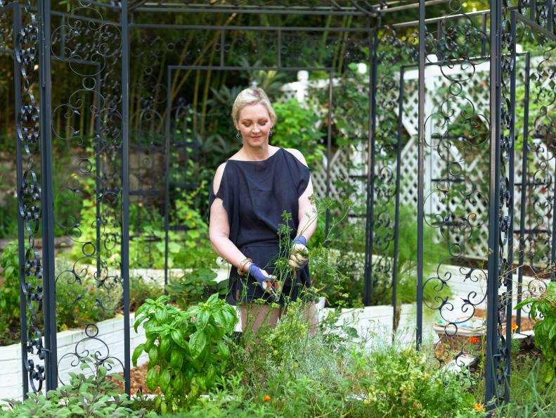 Rollins' highly aesthetic potager is conveniently located right outside her kitchen door for quick and easy access to her edibles. She grows a variety of heirloom vegetables and fruit and herbs, but is as focused on design here as in every other aspect of her Atlanta garden. "In a busy world, there is something therapeutic about digging in the dirt," says Rollins. And it's a democratic pursuit too. "People can't decorate on their own, but people can garden. It's so accessible."