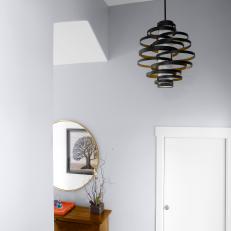 Gray Stairwell With Black Pendant Light