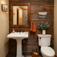 Neutral Rustic Powder Room With Paneling