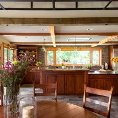 Rustic Open Plan Kitchen and Dining Area With Wide Doorway