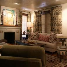 Southwestern Living Room With Orange Pillow