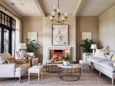 Luxury Coastal Living Room with Grasscloth Walls and a Fireplace